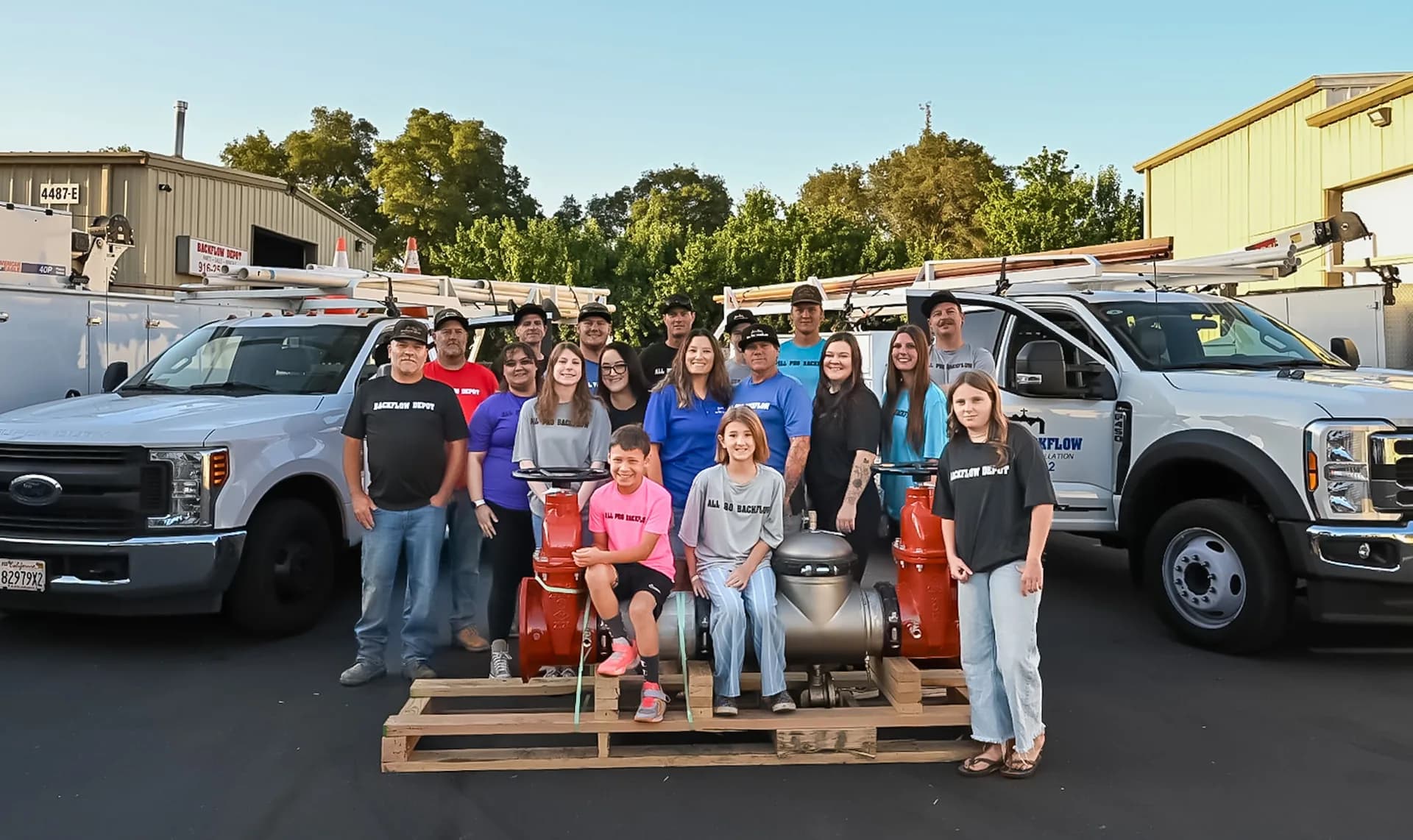 The All Pro Backflow team in front of their service trucks in Rocklin, CA